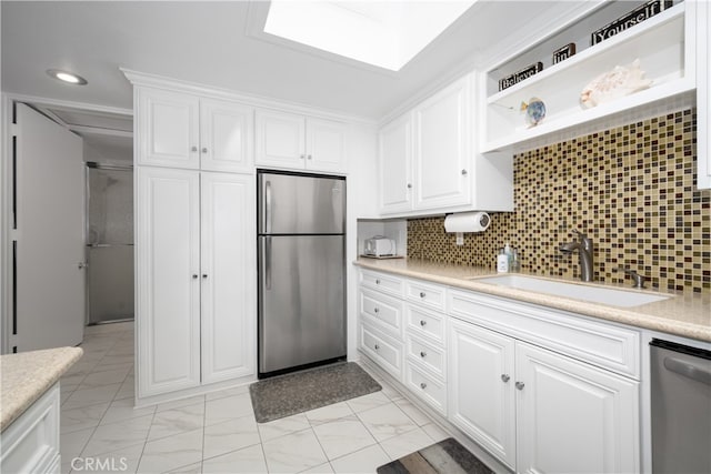 1420 Northwood Rd Unit 241C, Seal Beach, CA 90740 - kitchen featuring stainless steel appliances, a sink, light countertops, white cabinetry, and recessed lighting