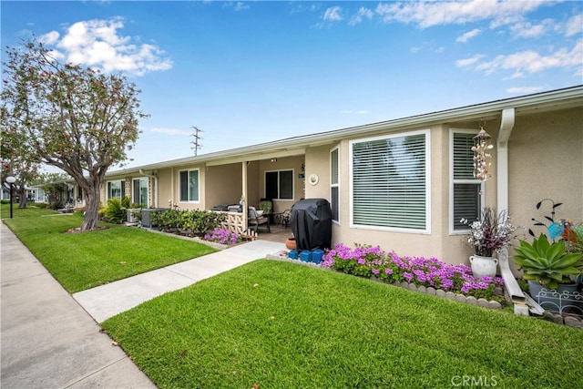 1420 Northwood Rd Unit 241C, Seal Beach, CA 90740 - single story home featuring stucco siding, a front lawn, and a patio
