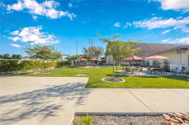1420 Northwood Rd Unit 241C, Seal Beach, CA 90740 - view of community featuring a yard and a patio area