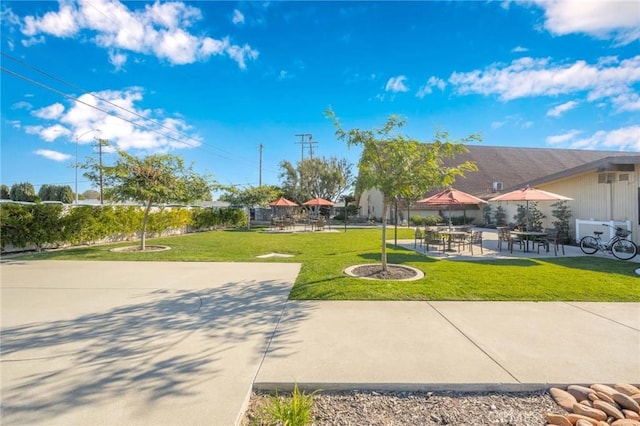 1420 Northwood Rd Unit 241C, Seal Beach, CA 90740 - view of property's community featuring a lawn and a patio area