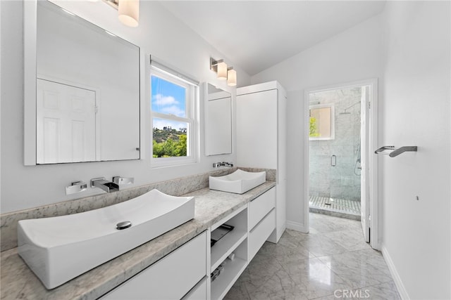 24532 Kings, Laguna Niguel, CA 92677 - bathroom featuring double vanity, a shower stall, marble finish floors, baseboards, and lofted ceiling