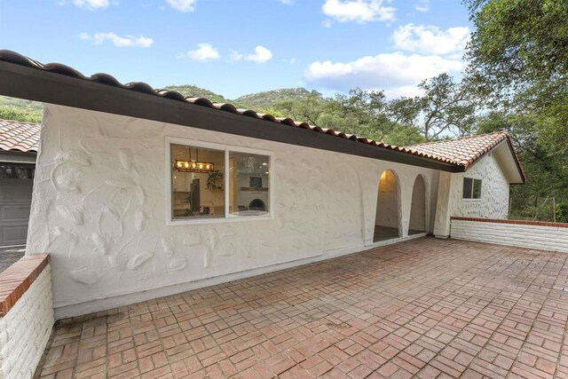 26230 N Lake Wohlford Rd, Valley Center, CA 92082 - back of house with a patio area, a tile roof, and stucco siding