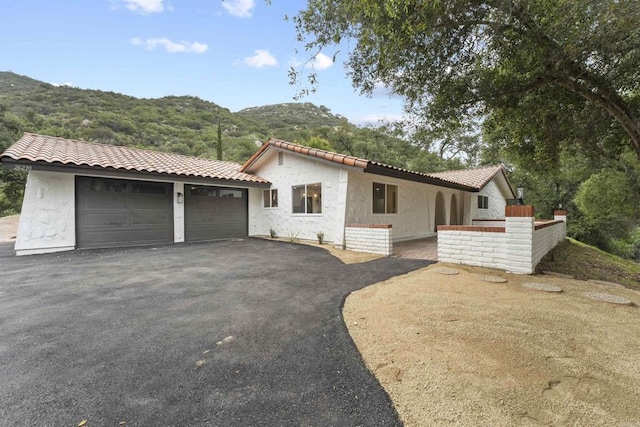 26230 N Lake Wohlford Rd, Valley Center, CA 92082 - mediterranean / spanish-style home featuring a mountain view, stucco siding, and a tile roof