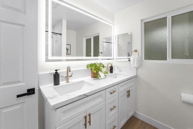 26230 N Lake Wohlford Rd, Valley Center, CA 92082 - bathroom with double vanity, wood finished floors, and baseboards