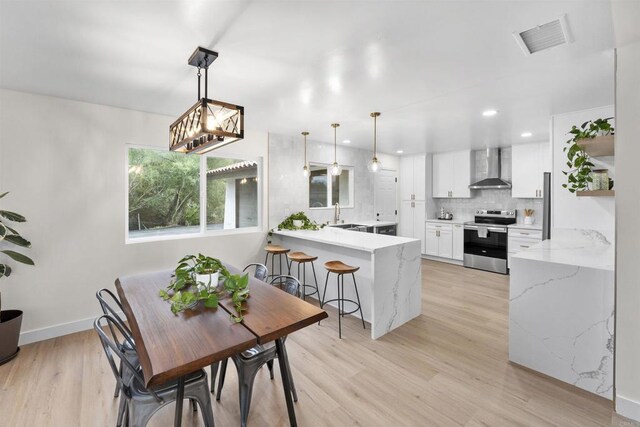 26230 N Lake Wohlford Rd, Valley Center, CA 92082 - dining room featuring light wood-style flooring, baseboards, and recessed lighting