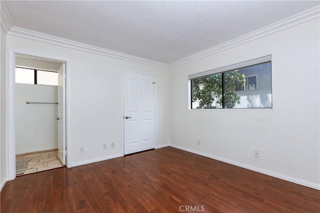 3516 E Ransom St Unit 103, Long Beach, CA 90804 - unfurnished bedroom with ornamental molding, wood finished floors, and baseboards