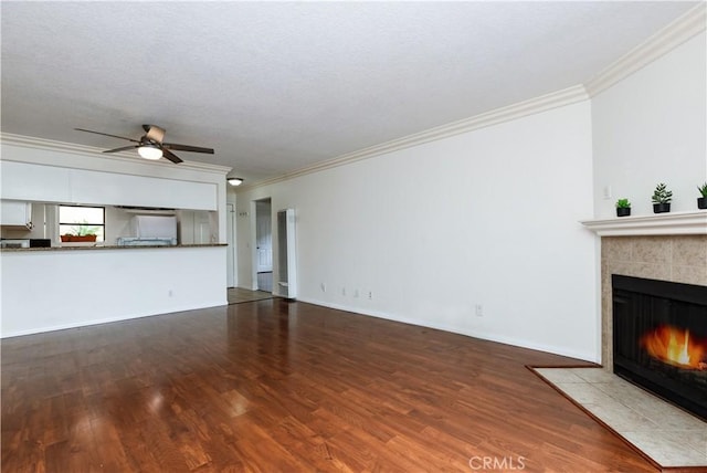 3516 E Ransom St Unit 103, Long Beach, CA 90804 - unfurnished living room with crown molding, a tile fireplace, wood finished floors, a ceiling fan, and baseboards