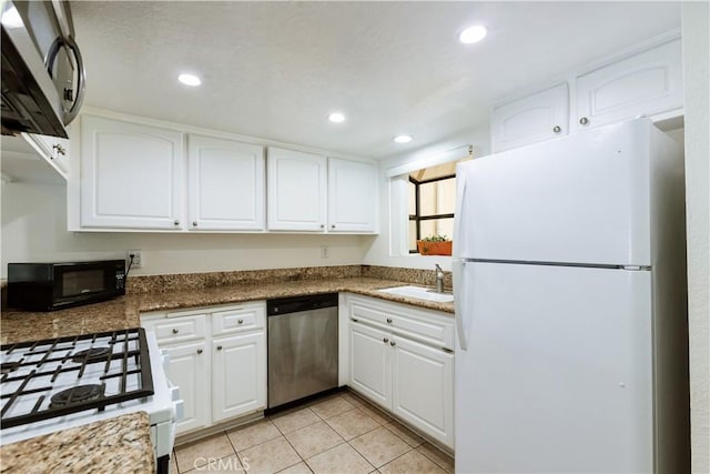 3516 E Ransom St Unit 103, Long Beach, CA 90804 - kitchen featuring white appliances, a sink, light tile patterned flooring, white cabinets, and recessed lighting