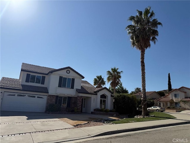 38422 Puma Ln, Palmdale, CA 93551 - traditional home featuring driveway, a garage, a tiled roof, and stucco siding