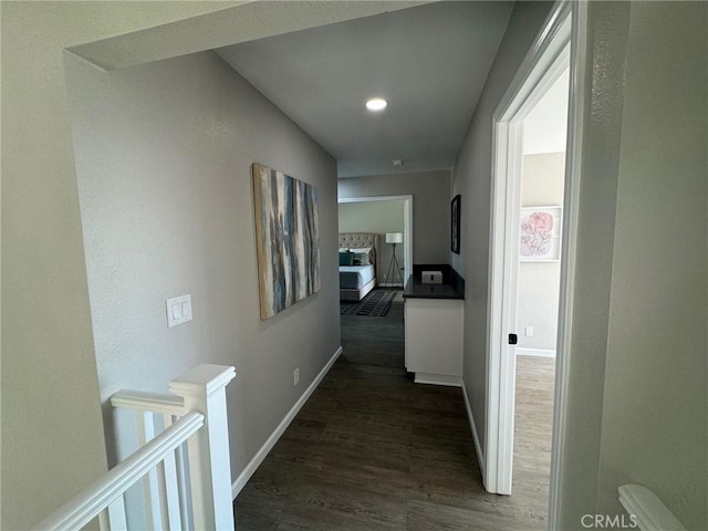 38422 Puma Ln, Palmdale, CA 93551 - hallway featuring dark wood finished floors, baseboards, an upstairs landing, and recessed lighting