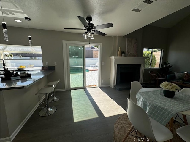 38422 Puma Ln, Palmdale, CA 93551 - living room with baseboards, a large fireplace, wood finished floors, and ceiling fan