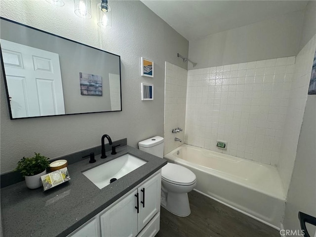 38422 Puma Ln, Palmdale, CA 93551 - bathroom featuring wood finished floors, vanity, shower / bath combination, toilet, and a textured wall