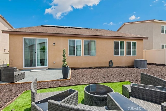 29589 Woodcreek Trl, Winchester, CA 92596 - back of property with central air condition unit, an outdoor living space, stucco siding, and a patio area
