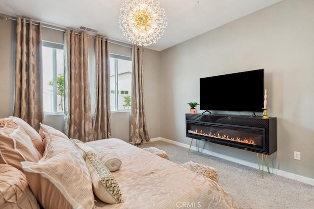 29589 Woodcreek Trl, Winchester, CA 92596 - carpeted bedroom featuring a chandelier, multiple windows, a glass covered fireplace, and baseboards