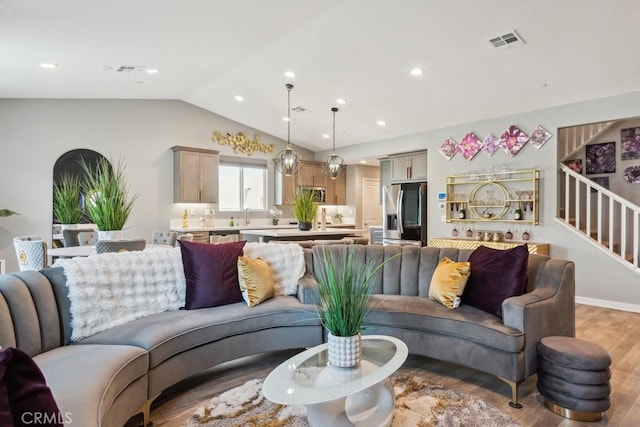 29589 Woodcreek Trl, Winchester, CA 92596 - living area with vaulted ceiling, light wood-style floors, recessed lighting, and stairway