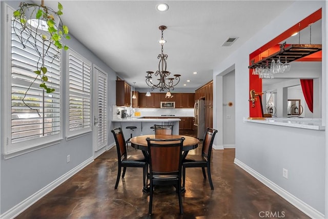 29259 Black Pine Way, Saugus, CA 91390 - dining area with finished concrete flooring, baseboards, recessed lighting, and a chandelier