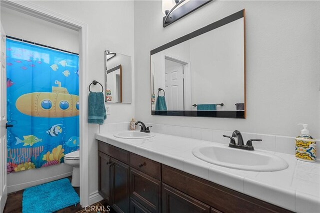 29259 Black Pine Way, Saugus, CA 91390 - bathroom with toilet, double vanity, and curtained shower