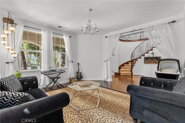 29259 Black Pine Way, Saugus, CA 91390 - living area with stairs, a chandelier, wood finished floors, and baseboards