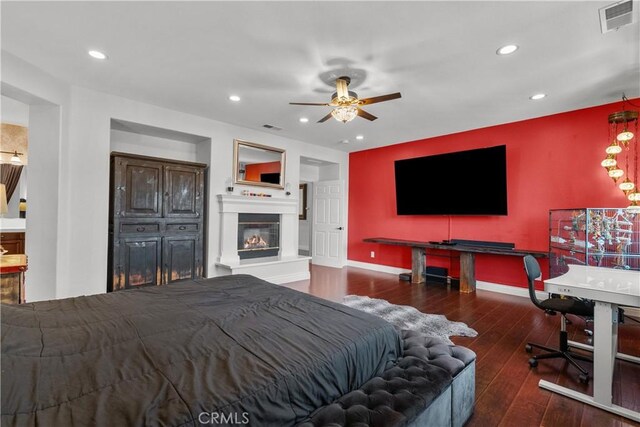 29259 Black Pine Way, Saugus, CA 91390 - bedroom featuring a glass covered fireplace, hardwood / wood-style floors, recessed lighting, baseboards, and a ceiling fan