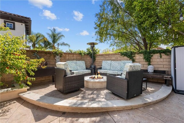 29259 Black Pine Way, Saugus, CA 91390 - fenced backyard with an outdoor living space with a fire pit and a patio
