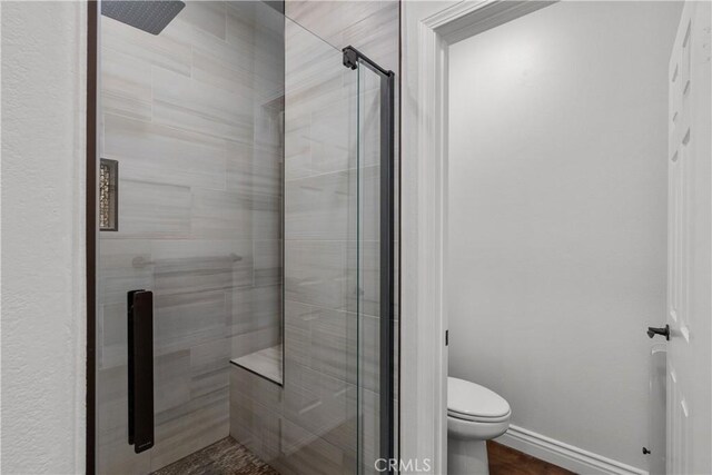 29259 Black Pine Way, Saugus, CA 91390 - full bath featuring a stall shower, toilet, and baseboards