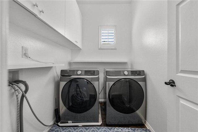 29259 Black Pine Way, Saugus, CA 91390 - laundry area featuring cabinet space, washing machine and clothes dryer, and baseboards