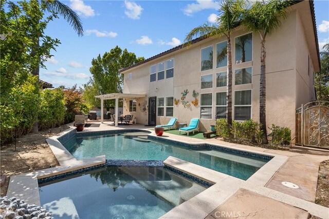 29259 Black Pine Way, Saugus, CA 91390 - view of pool featuring a pergola, a pool with connected hot tub, and a patio