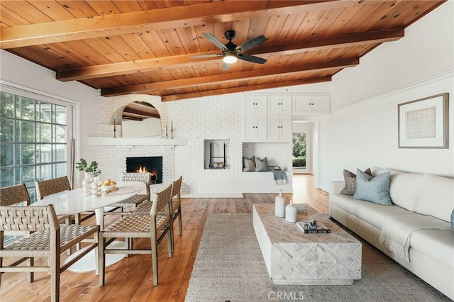 27317 Sunnyridge Rd, Palos Verdes Peninsula, CA 90274 - living area with wood ceiling with exposed beams, light wood-type flooring, ceiling fan, and a fireplace