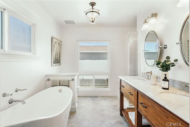 27317 Sunnyridge Rd, Palos Verdes Peninsula, CA 90274 - bathroom with a freestanding bath, double vanity, and tile patterned floors