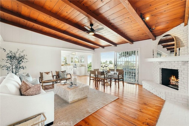 27317 Sunnyridge Rd, Palos Verdes Peninsula, CA 90274 - living area with wood ceiling, hardwood / wood-style flooring, a ceiling fan, and a fireplace
