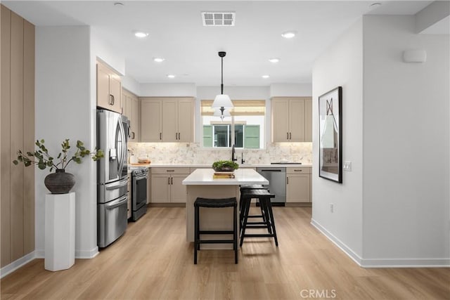 22304 Sage Ct, Torrance, CA 90502 - kitchen featuring appliances with stainless steel finishes, light wood finished floors, backsplash, light countertops, and recessed lighting