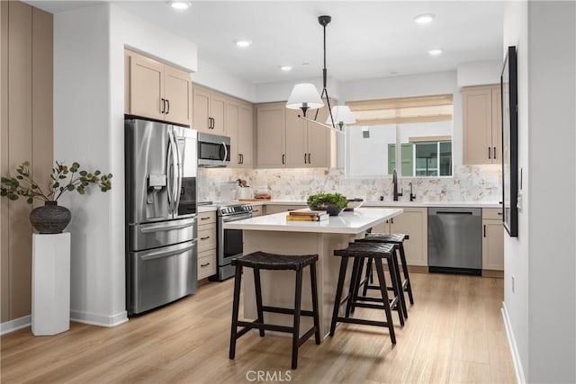 22304 Sage Ct, Torrance, CA 90502 - kitchen featuring stainless steel appliances, light wood-style flooring, decorative backsplash, light countertops, and recessed lighting