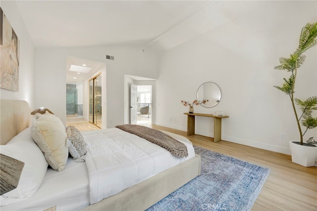 23043 Park Este, Calabasas, CA 91302 - bedroom with wood finished floors, lofted ceiling, and ensuite bath