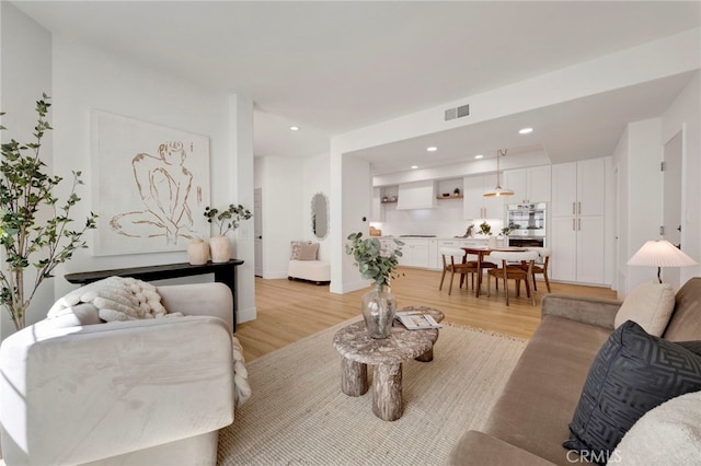 23043 Park Este, Calabasas, CA 91302 - living area with light wood-type flooring and recessed lighting
