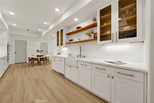 23043 Park Este, Calabasas, CA 91302 - kitchen with white cabinets, light wood finished floors, light countertops, open shelves, and recessed lighting