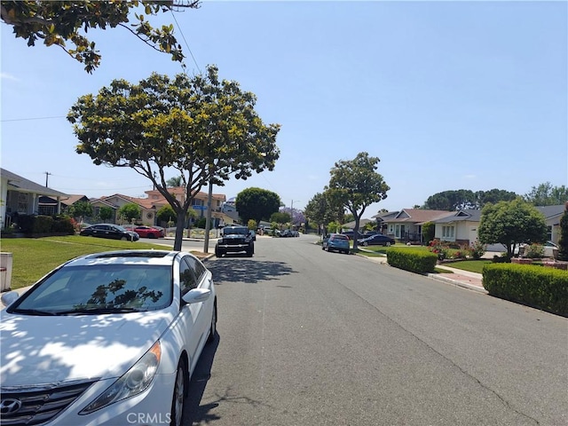 925 W Autumn Dr, Anaheim, CA 92805 - view of asphalt street with a residential view, sidewalks, and curbs