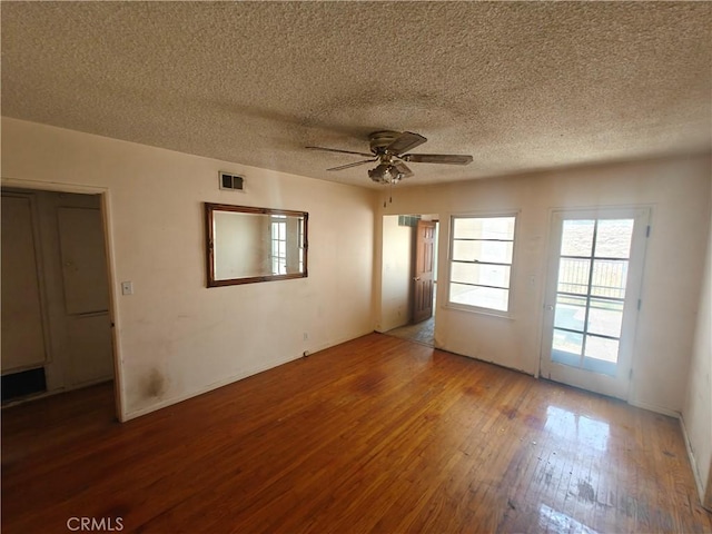 925 W Autumn Dr, Anaheim, CA 92805 - spare room featuring ceiling fan, hardwood / wood-style flooring, a textured ceiling, and baseboards