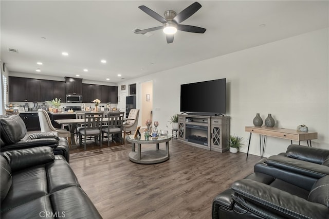 14226 Bonavento Ln, Beaumont, CA 92223 - living room featuring a ceiling fan, wood finished floors, and recessed lighting