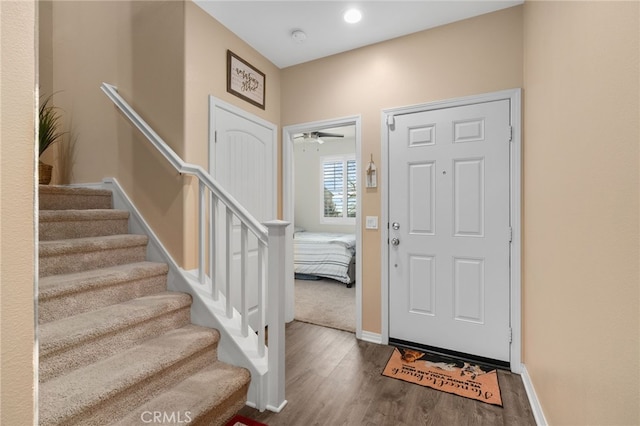 14226 Bonavento Ln, Beaumont, CA 92223 - entryway featuring wood finished floors, stairway, baseboards, and ceiling fan