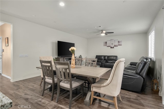 14226 Bonavento Ln, Beaumont, CA 92223 - dining room featuring wood finished floors, a ceiling fan, and baseboards