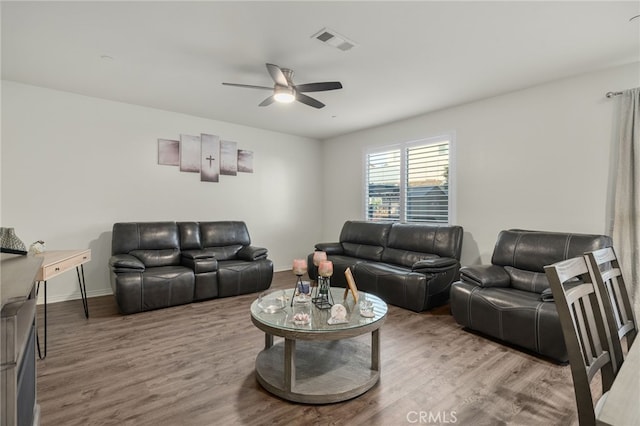 14226 Bonavento Ln, Beaumont, CA 92223 - living area with a ceiling fan, wood finished floors, and baseboards