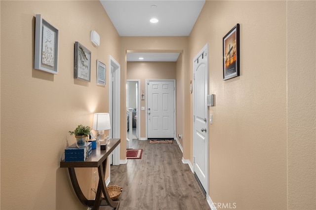 14226 Bonavento Ln, Beaumont, CA 92223 - entryway with wood finished floors, baseboards, and recessed lighting