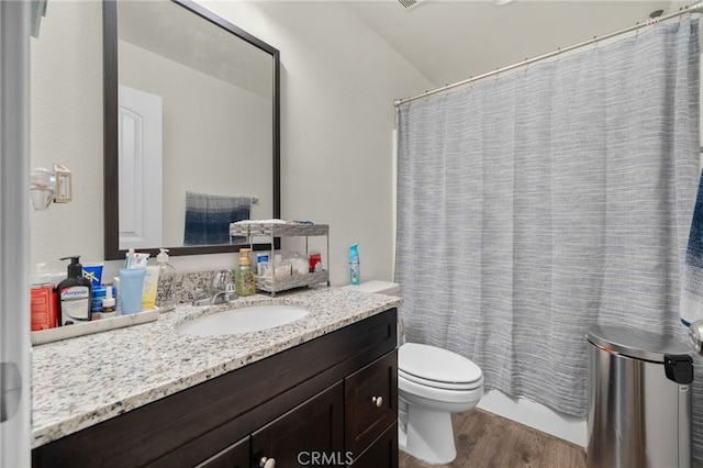 14226 Bonavento Ln, Beaumont, CA 92223 - full bathroom featuring wood finished floors, vanity, and toilet