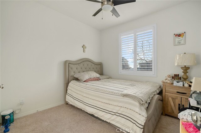 14226 Bonavento Ln, Beaumont, CA 92223 - carpeted bedroom with baseboards and ceiling fan