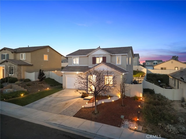 14226 Bonavento Ln, Beaumont, CA 92223 - traditional-style house featuring stucco siding, driveway, an attached garage, and a residential view