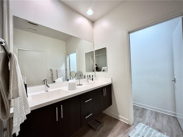 3945 Eagle Rock Blvd Unit 51, Los Angeles, CA 90065 - full bath with wood finished floors, double vanity, and baseboards