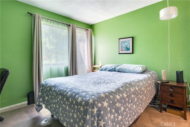 242 E Fern Ave Unit 206, Redlands, CA 92373 - carpeted bedroom featuring a textured wall, a textured ceiling, and baseboards