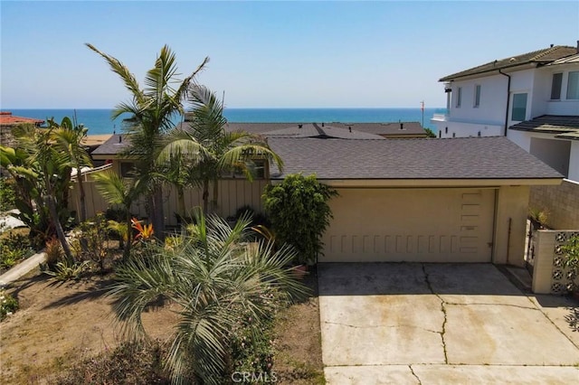 2018 Calle De Los Alamos, San Clemente, CA 92672 - view of front of house with a garage, driveway, a water view, stucco siding, and roof with shingles