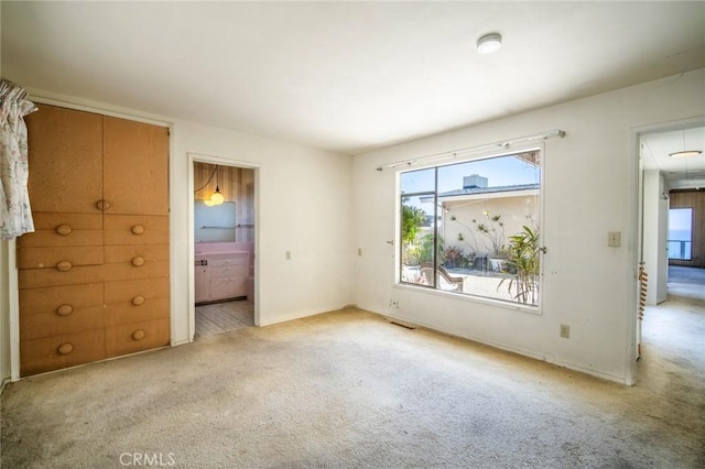 2018 Calle De Los Alamos, San Clemente, CA 92672 - unfurnished bedroom featuring light carpet, multiple windows, attic access, and baseboards