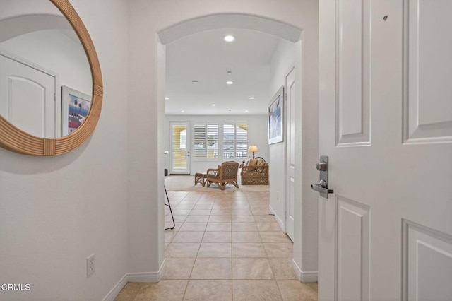 6287 Turnstone St Unit 4-304, Ventura, CA 93003 - hallway featuring light tile patterned flooring, recessed lighting, and arched walkways